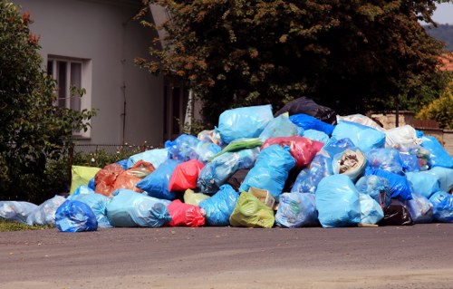 Company van collecting commercial waste at a depot