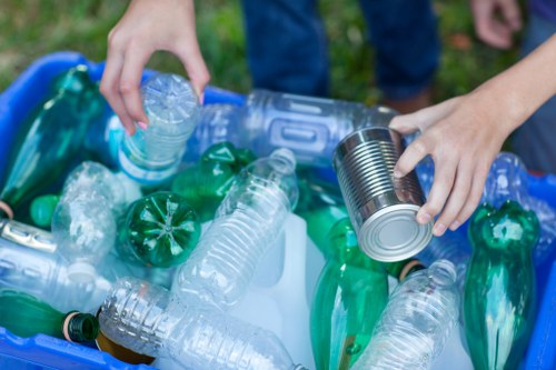 Workers sorting recyclables at a local transfer station